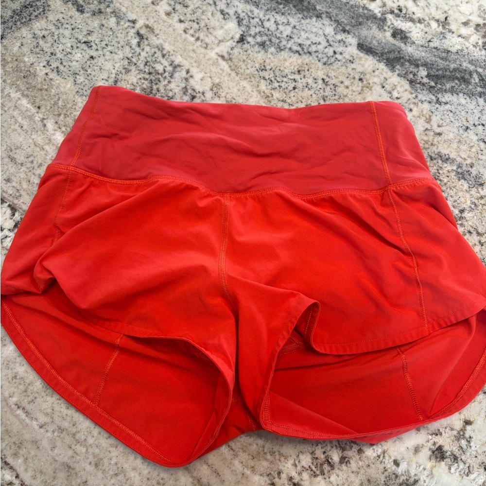 Red lululemon women’s size 4 speed up high-rise 2.5” lined shorts